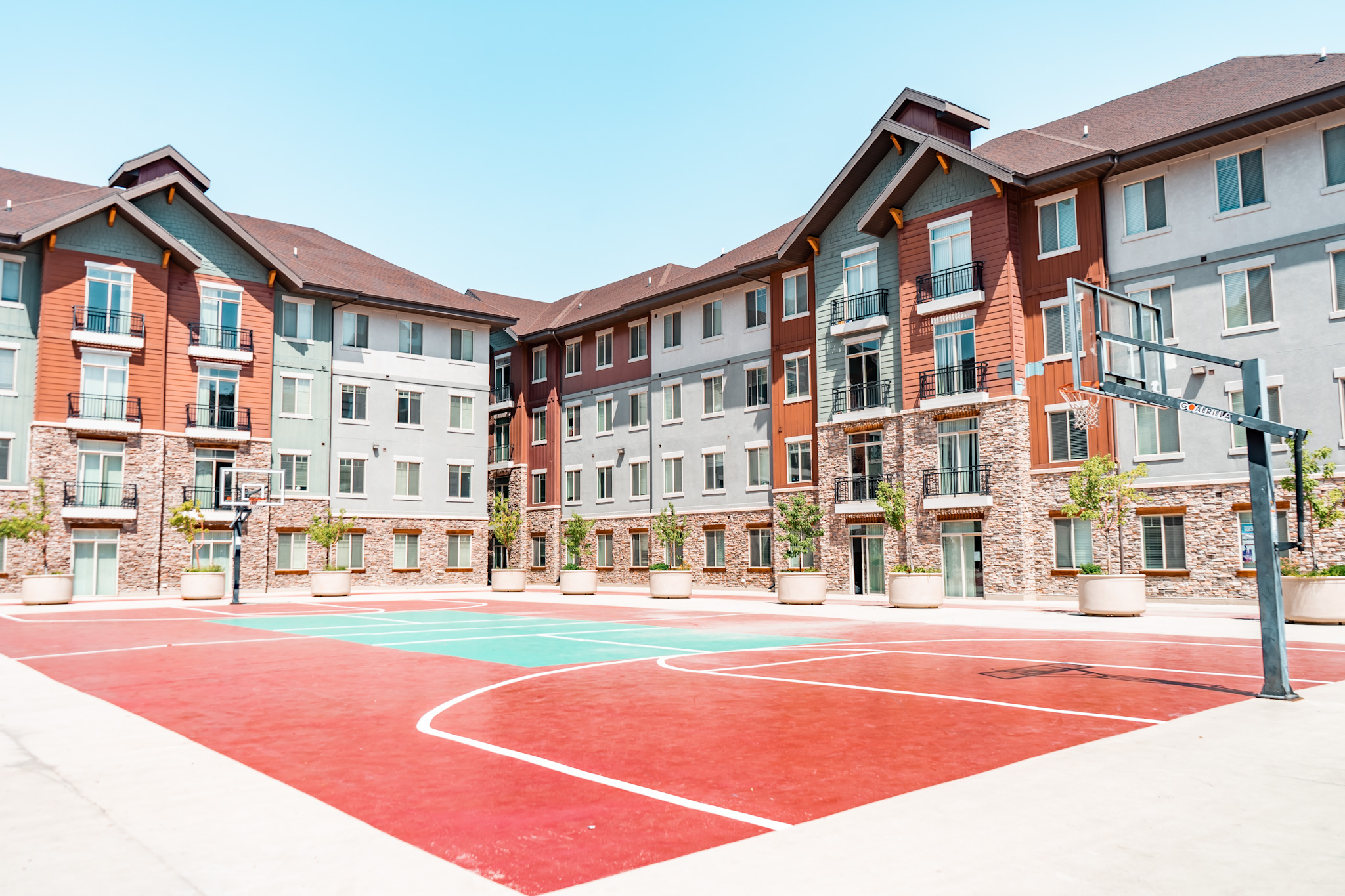 Outdoor basketball and foursquare courts in the Alpine Village courtyard